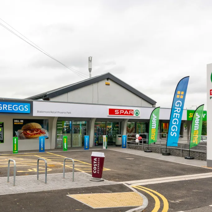 Front of a SPAR convenience store with Greggs and Subway signage also showing.