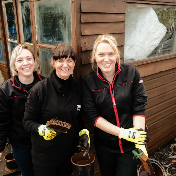 SPAR store members working at a local community project.